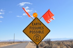 Earth Fissures Possible road sign.