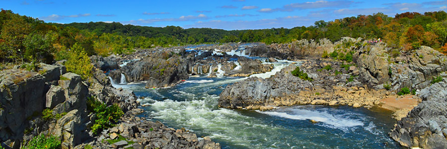 Wide view of white water cascading over falls in Fairfax County, Virginia